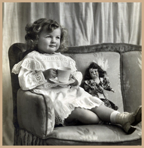 A little Edwardian Girl having Tea