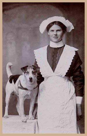 An edwardian maid with a dog